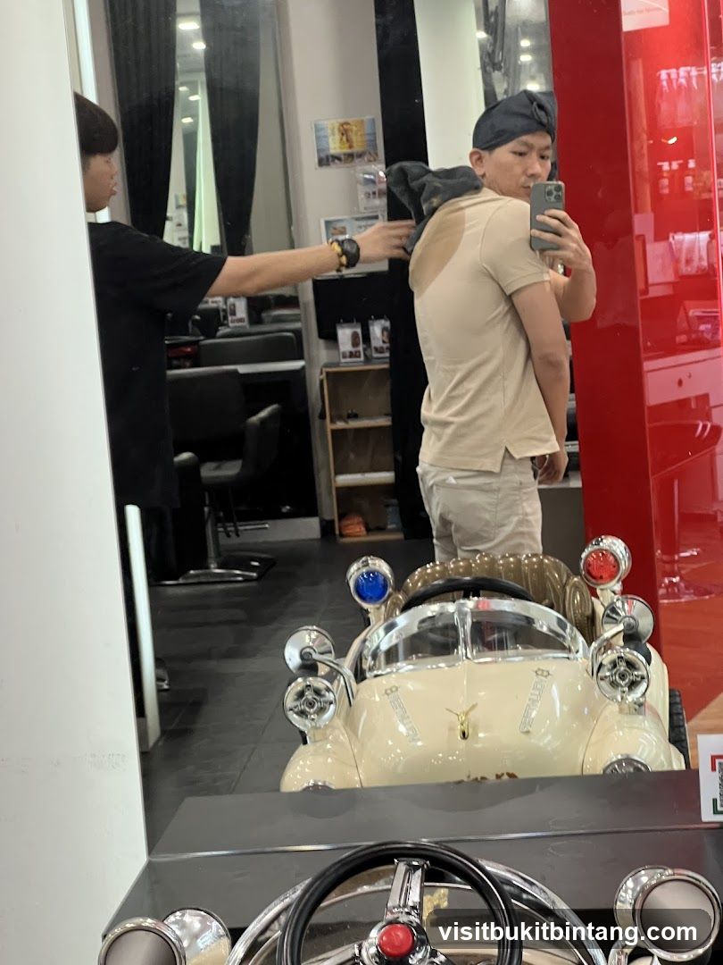 Barber drying client's hair