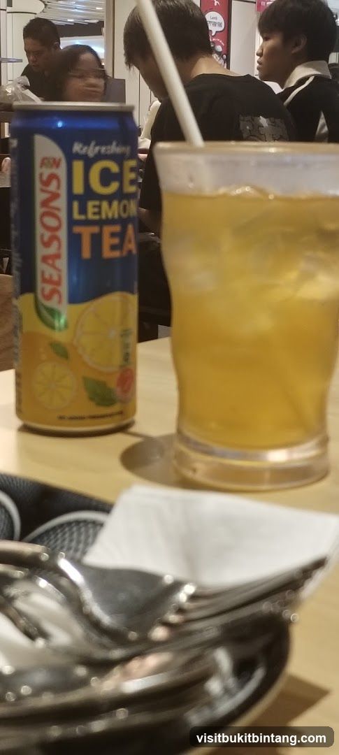 Ice Lemon Tea Can and Drink