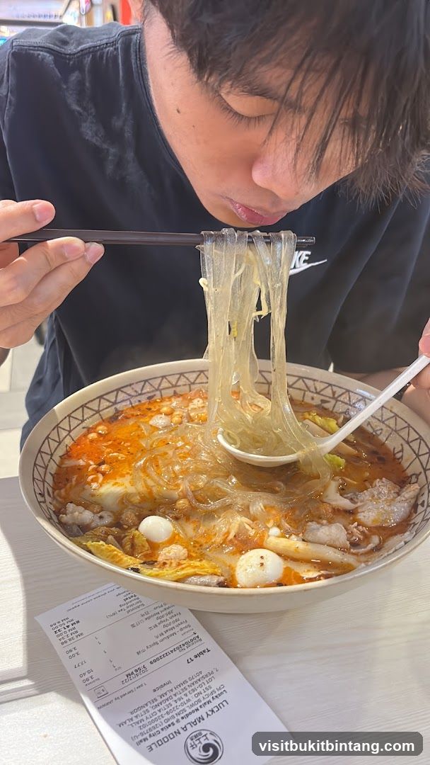 Person eating noodles