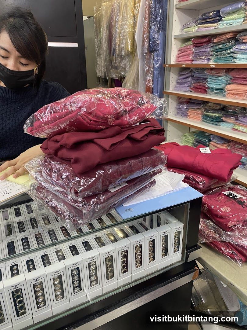 Woman at Counter with Folded Garments