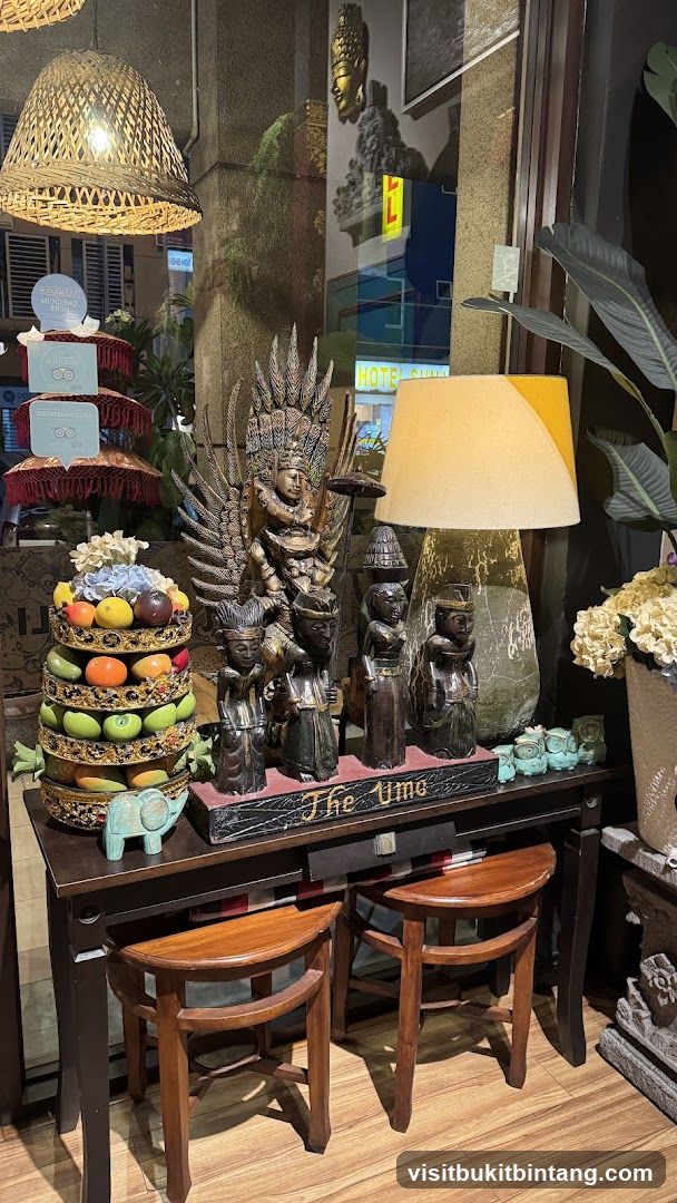 Decorative display with Balinese figurines and fruit stand