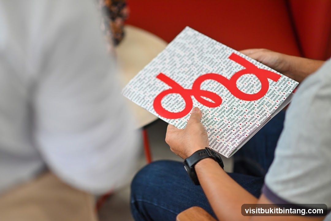 Person holding a booklet with