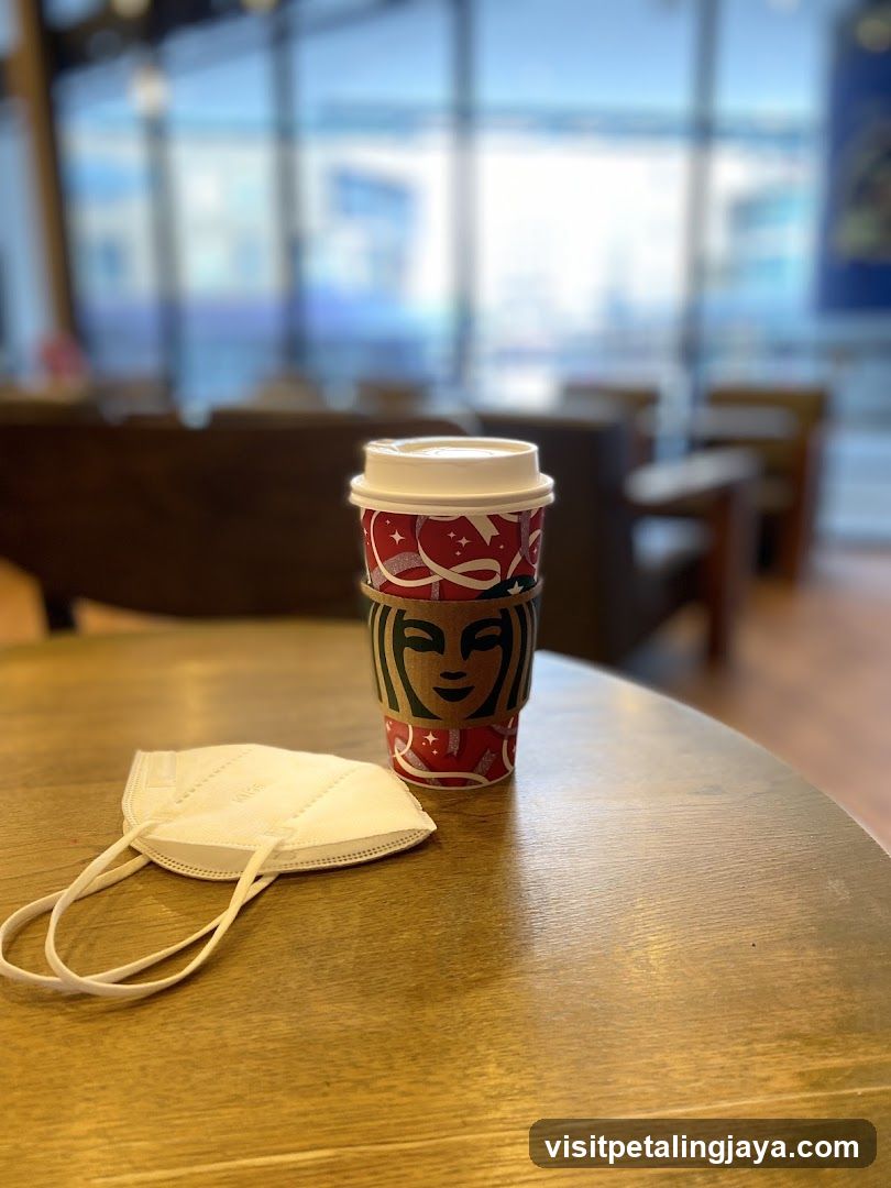 Starbucks Coffee Cup and Mask on Table