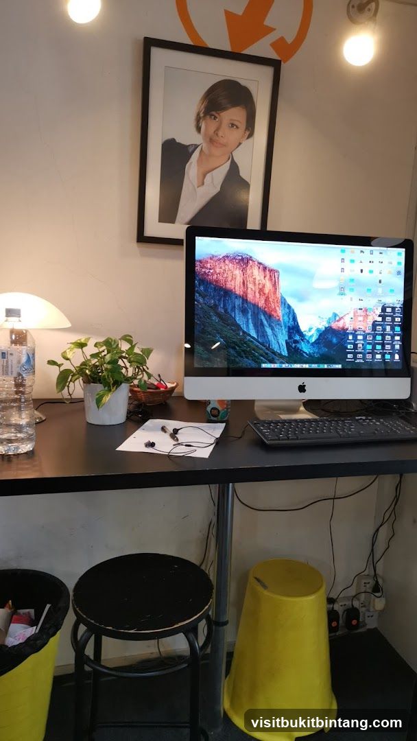 Desk with Computer and Portrait