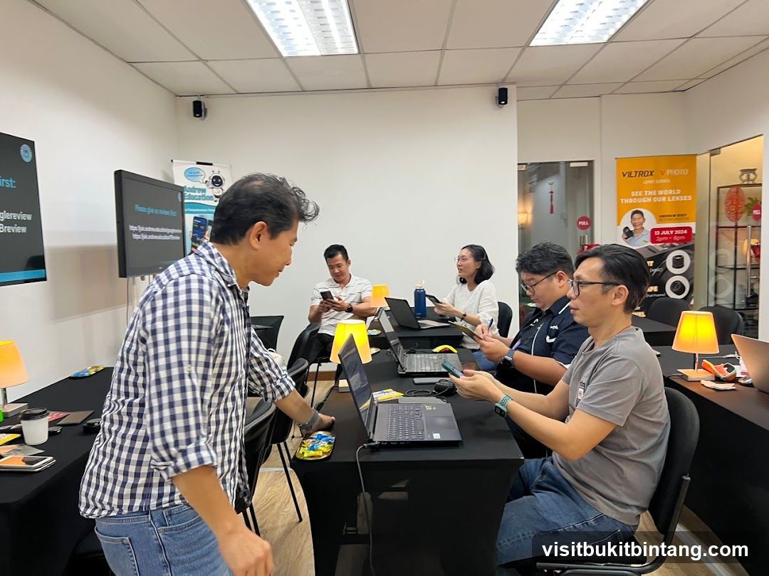 Workshop attendees using laptops and phones