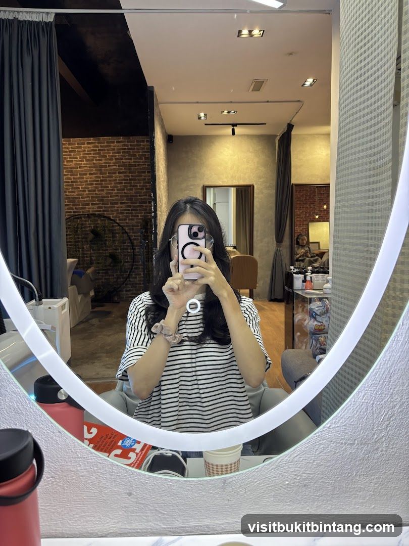 Woman taking a mirror selfie in a salon