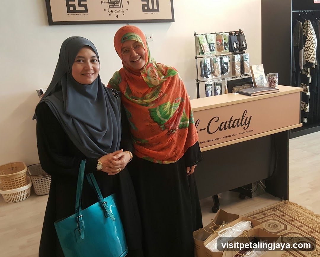 Two women in hijab at a boutique counter