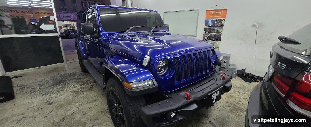 Blue Jeep Wrangler in Workshop