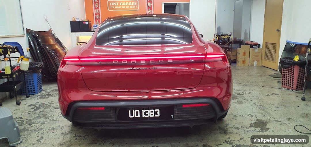 Red Porsche Taycan in Workshop