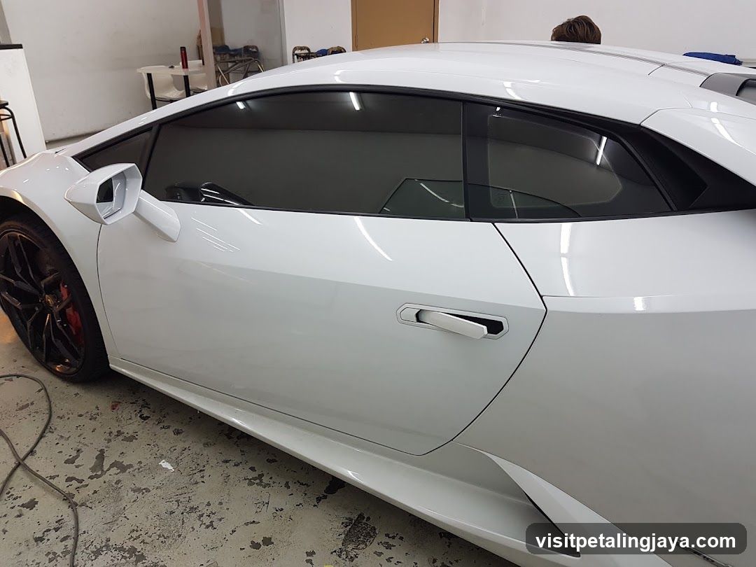 White sports car in workshop
