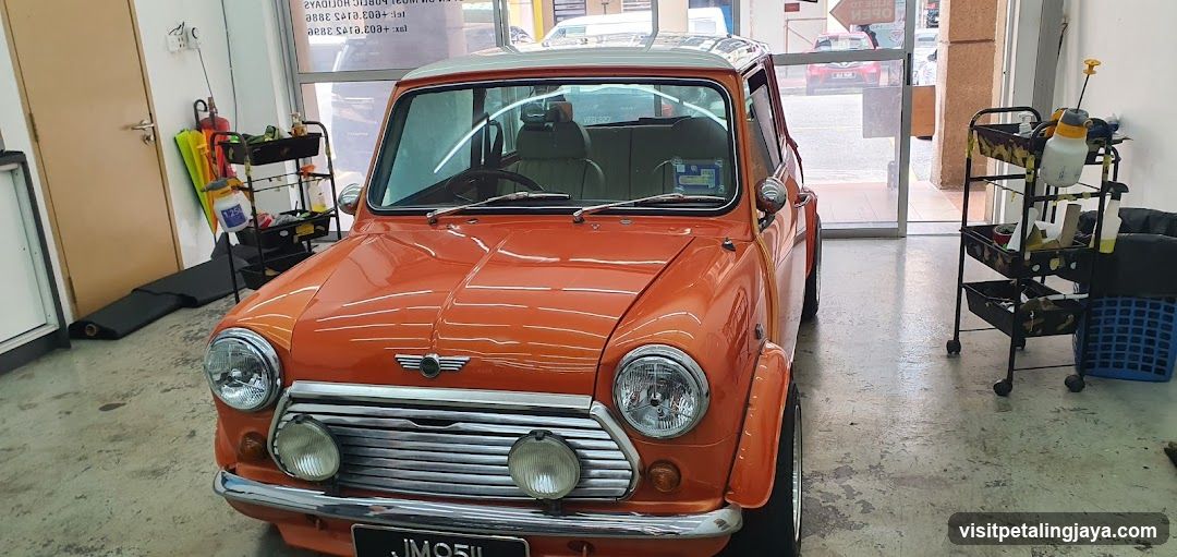 Orange Mini Cooper in Garage