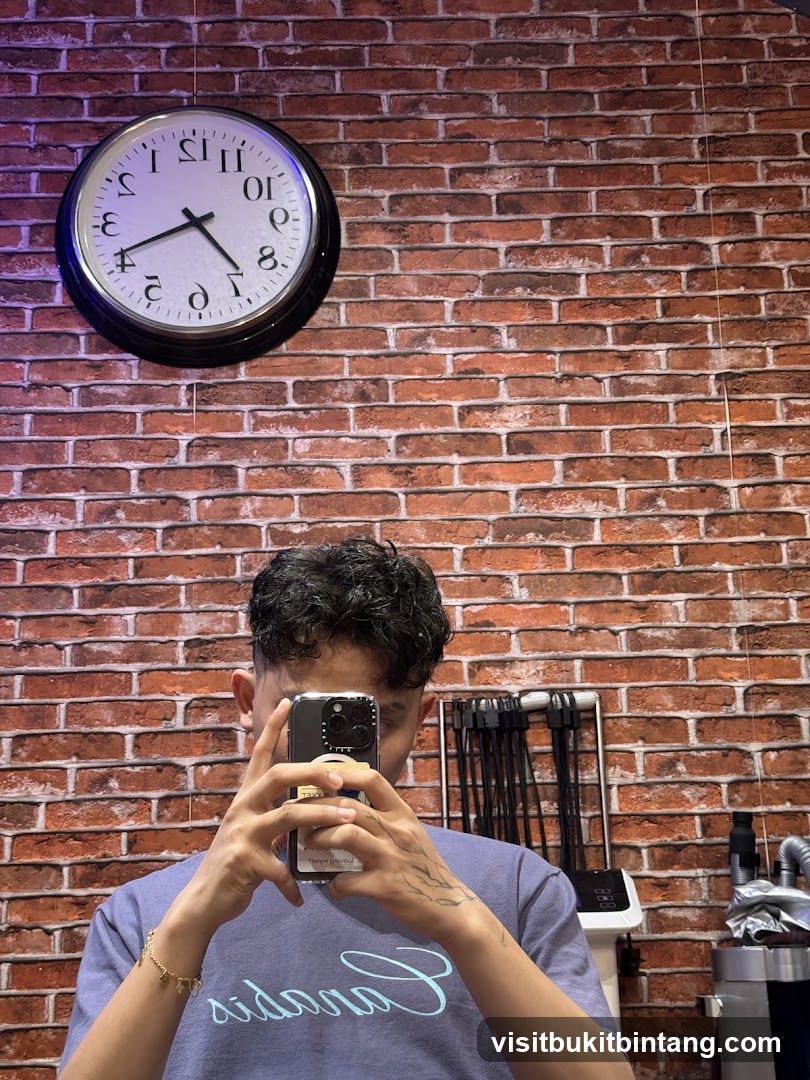 Man taking a selfie in a barbershop