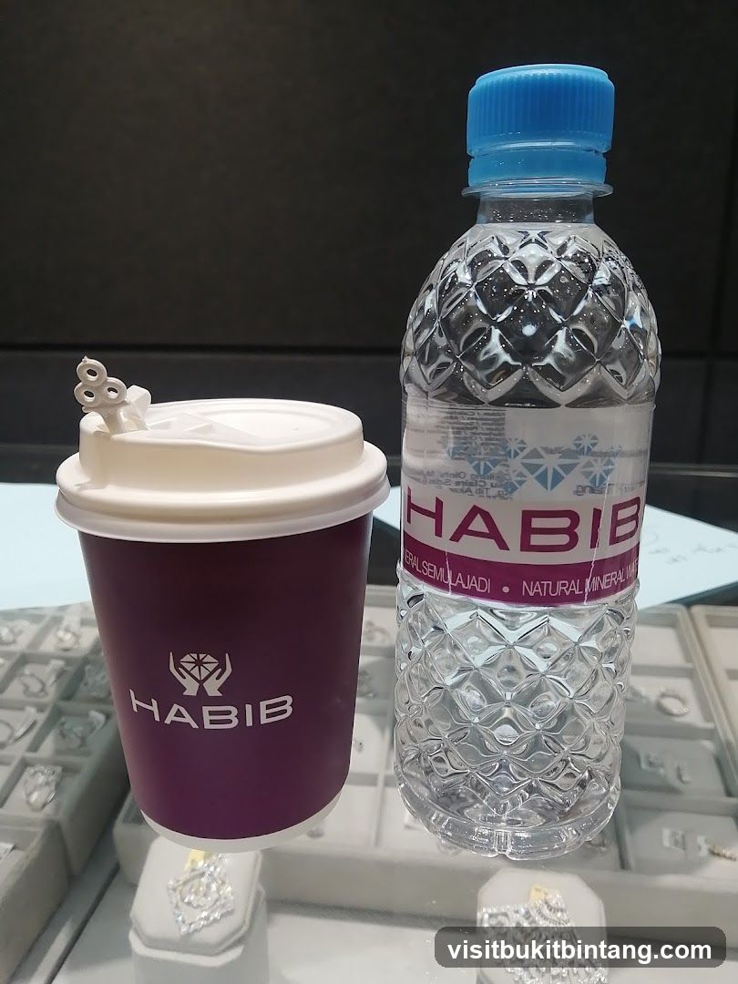 Habib branded coffee cup and water bottle