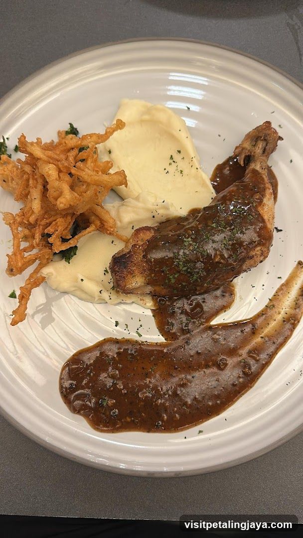 Plate of Chicken with Gravy and Fries