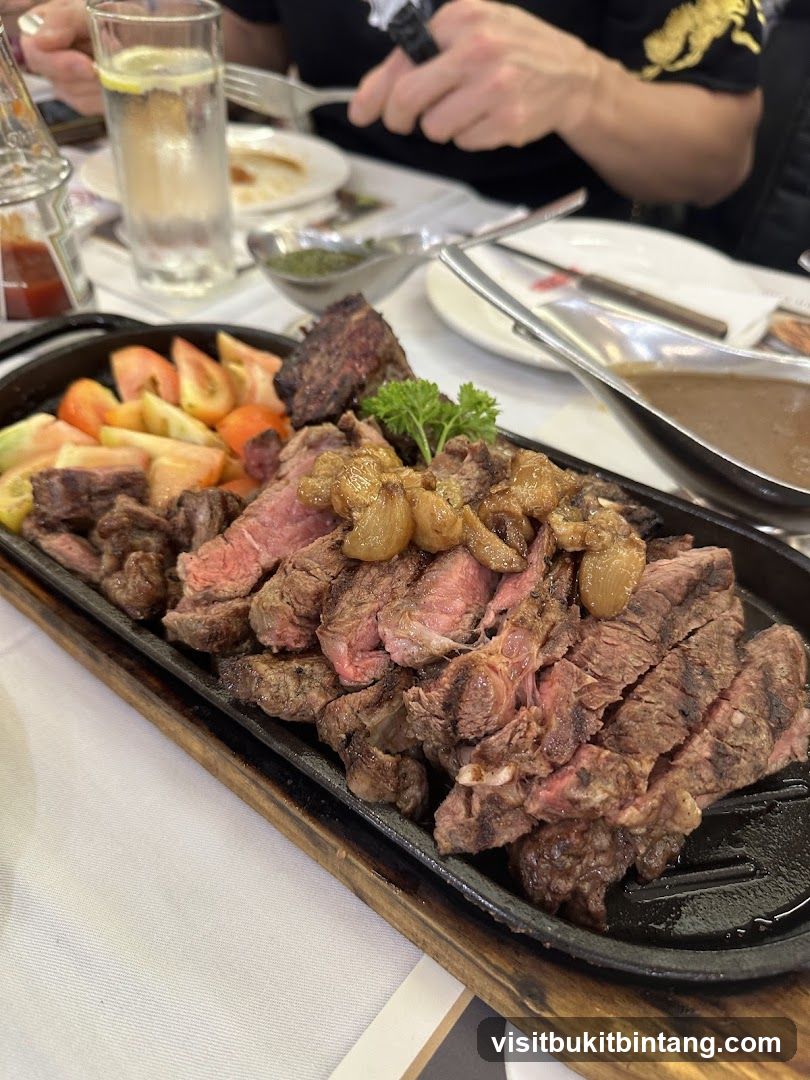 Sliced steak with tomatoes and sauce