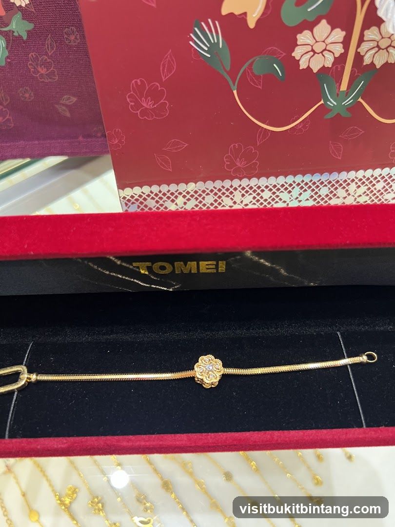 Gold Bracelet with Flower Charm