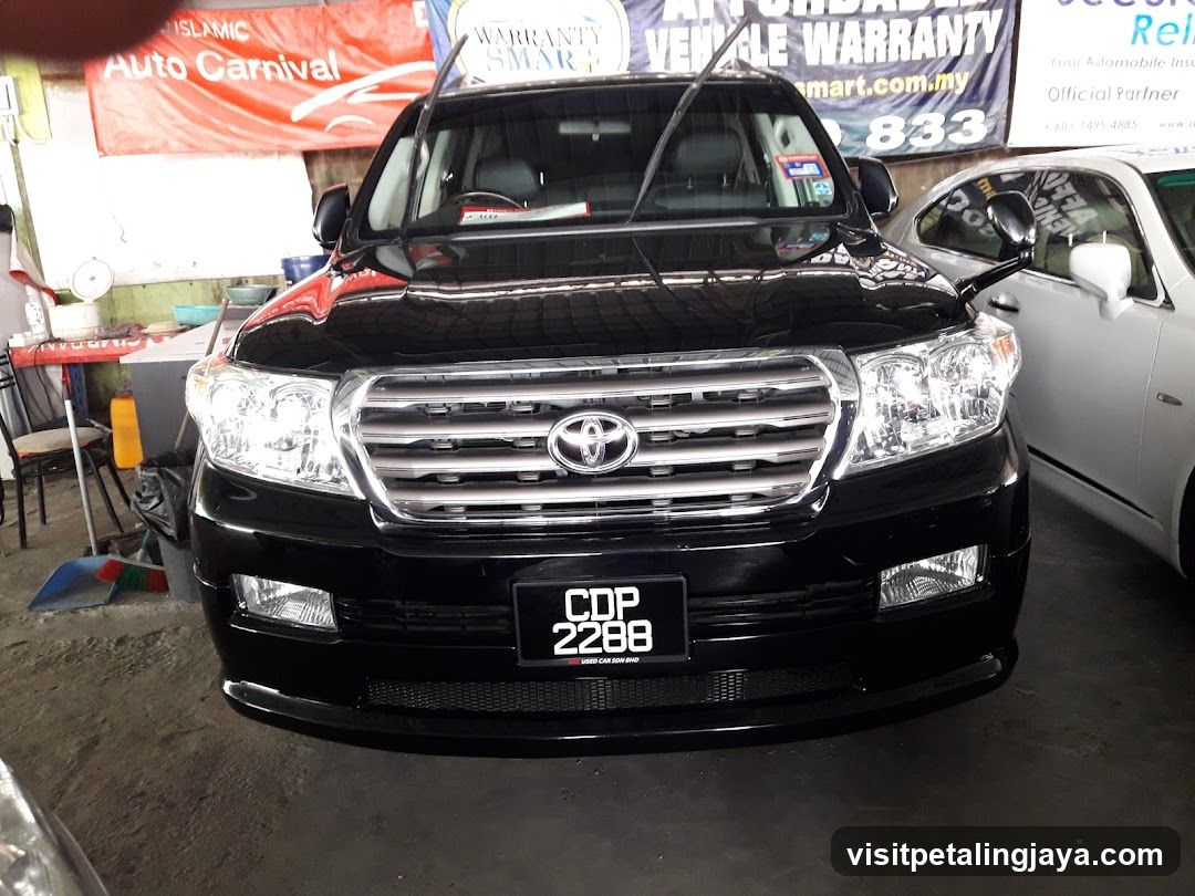 Black Toyota SUV in a garage or workshop setting