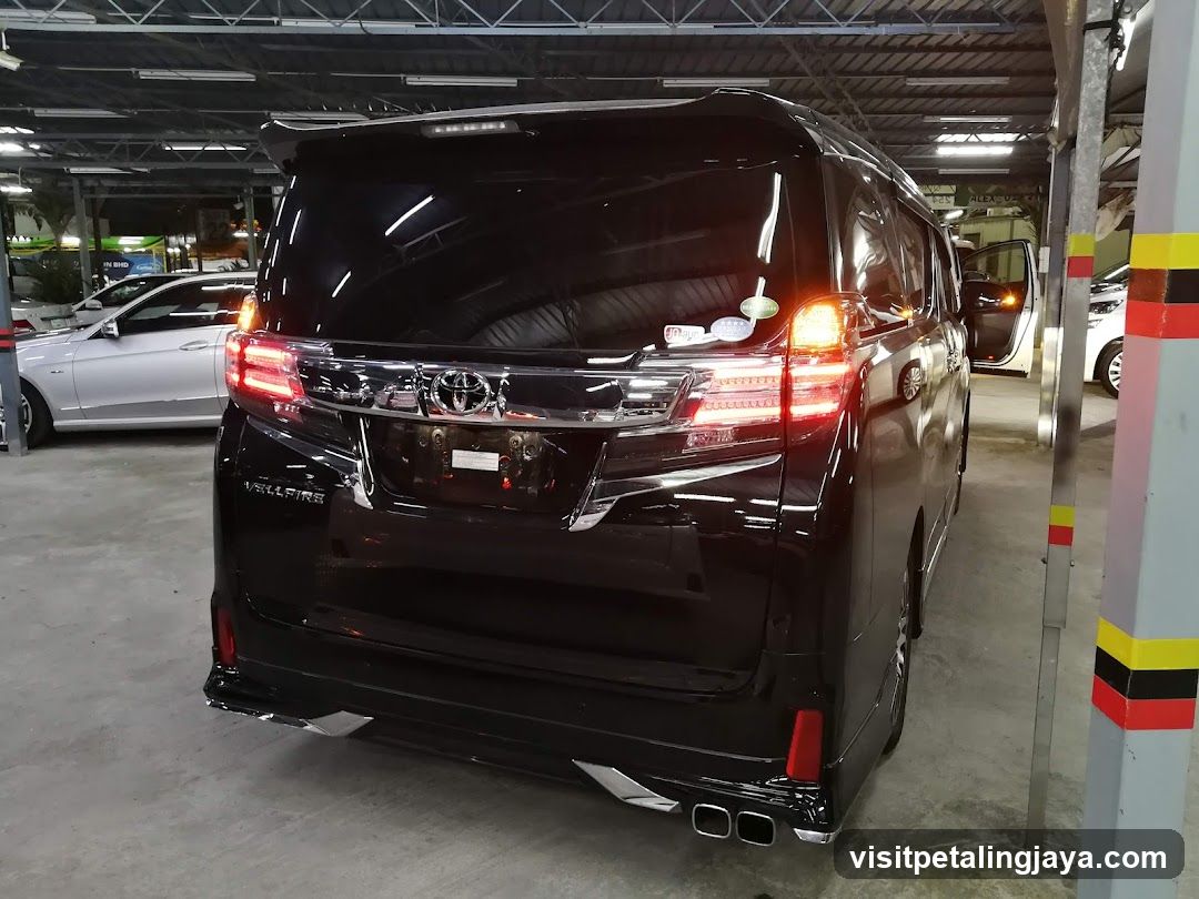 Black Toyota Alphard Rear View in Parking Garage