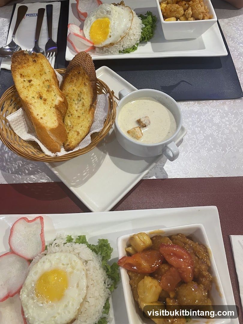 Food spread with rice, fried egg, and soup
