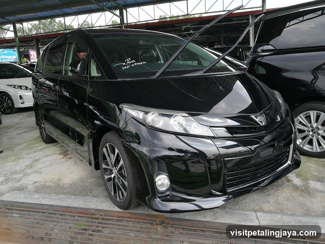 Black Toyota Alphard in a car showroom