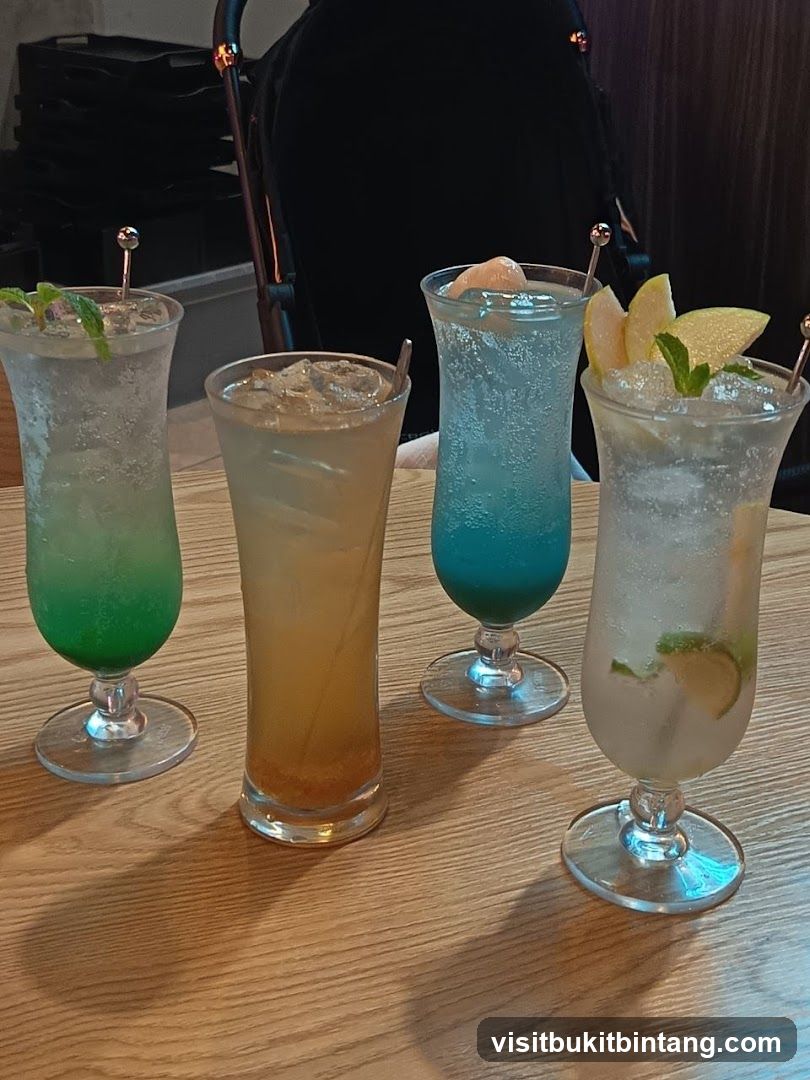 Four Colorful Drinks on a Wooden Table