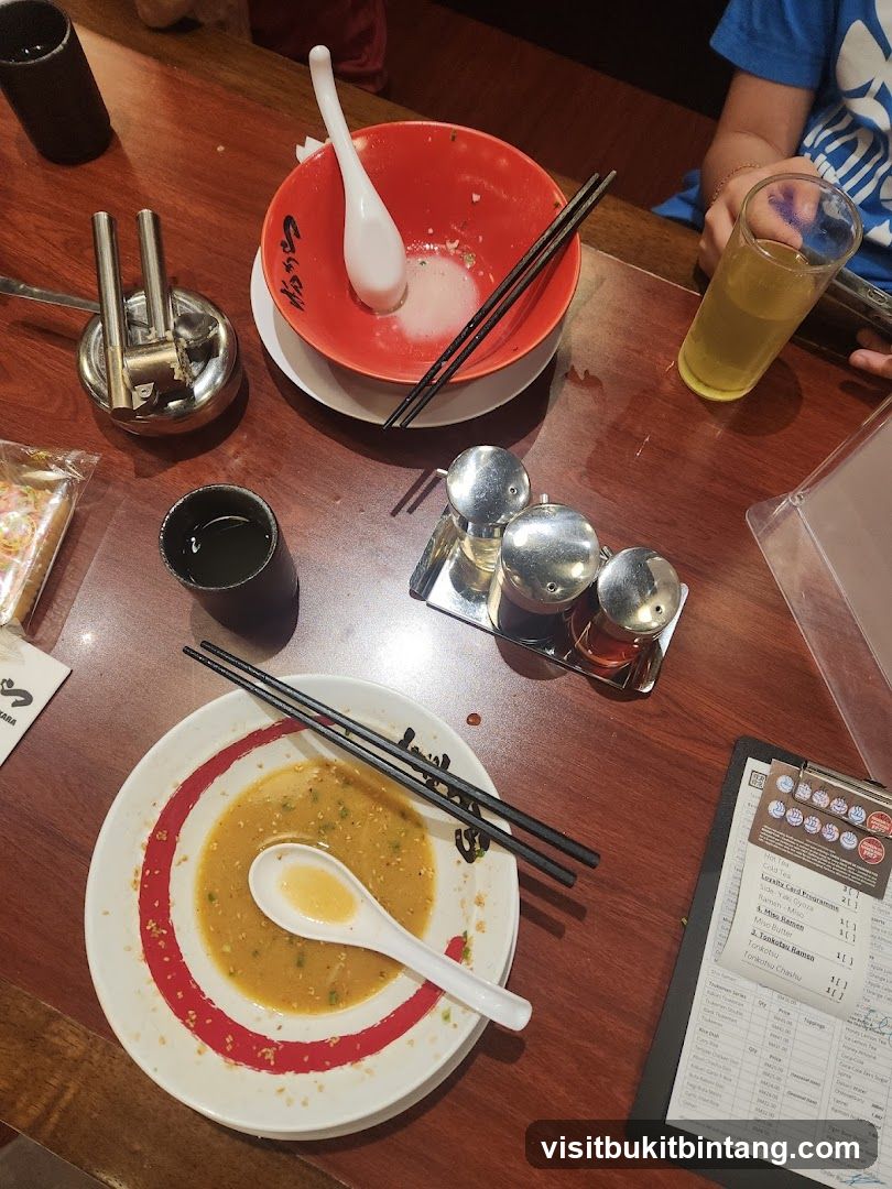 Table with Ramen Bowls and Menu
