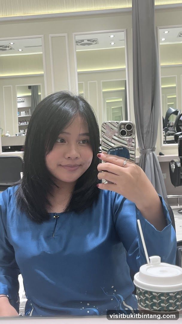 Woman taking a selfie in a salon