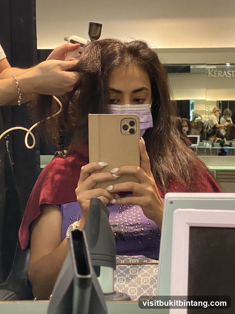 Woman getting hair styled