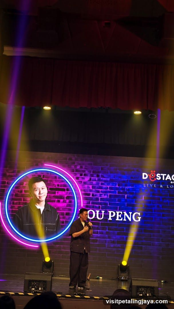 Stage Performance with Neon Backdrop