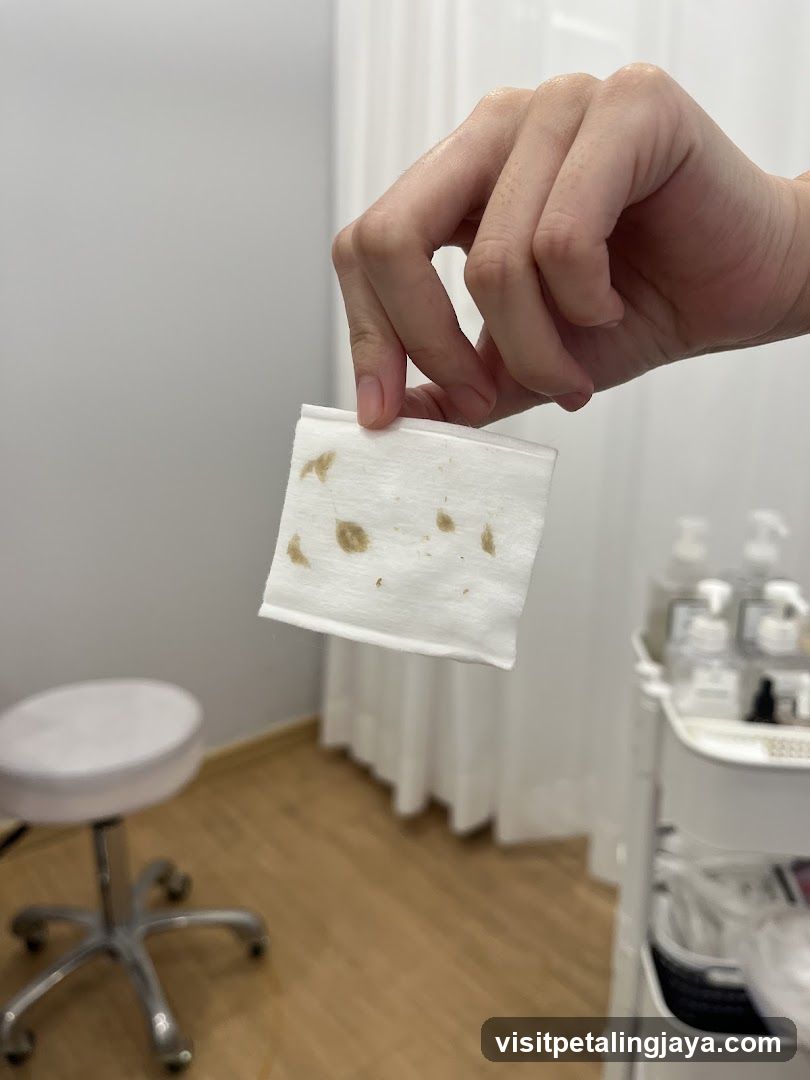 Hand holding stained wipe in salon