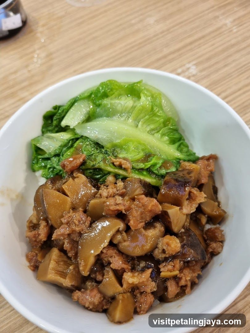Bowl of Stir-fried Meat and Vegetables with Lettuce