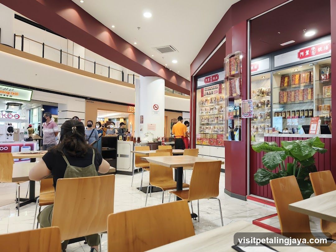 Food Court Interior with Dining Area and Shop Fronts