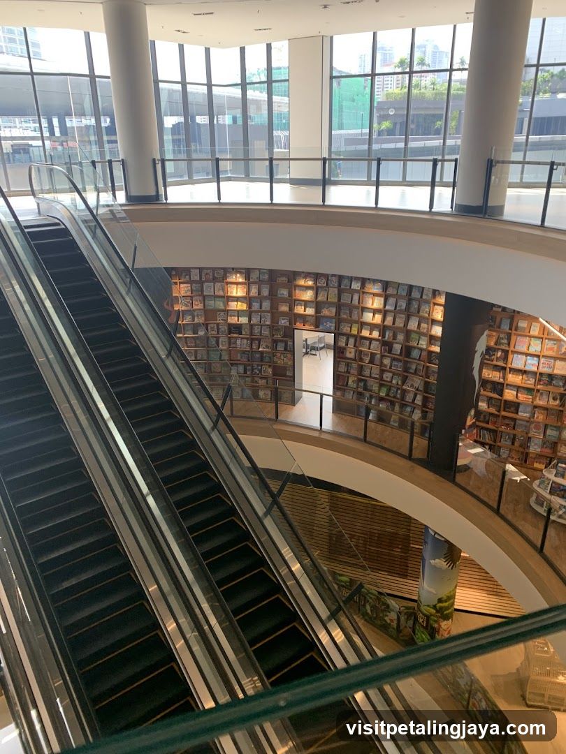 Interior of a modern bookstore or library with escalators and bookshelves