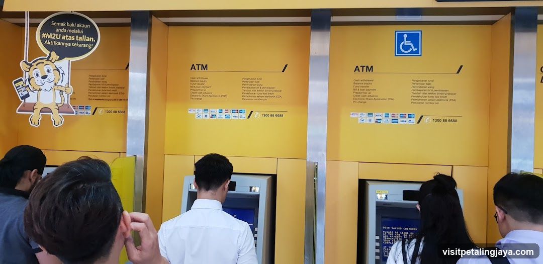 ATM Machine Area with People Using Machines