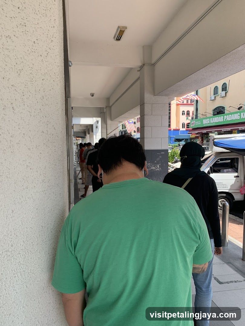 People waiting in line outside a building