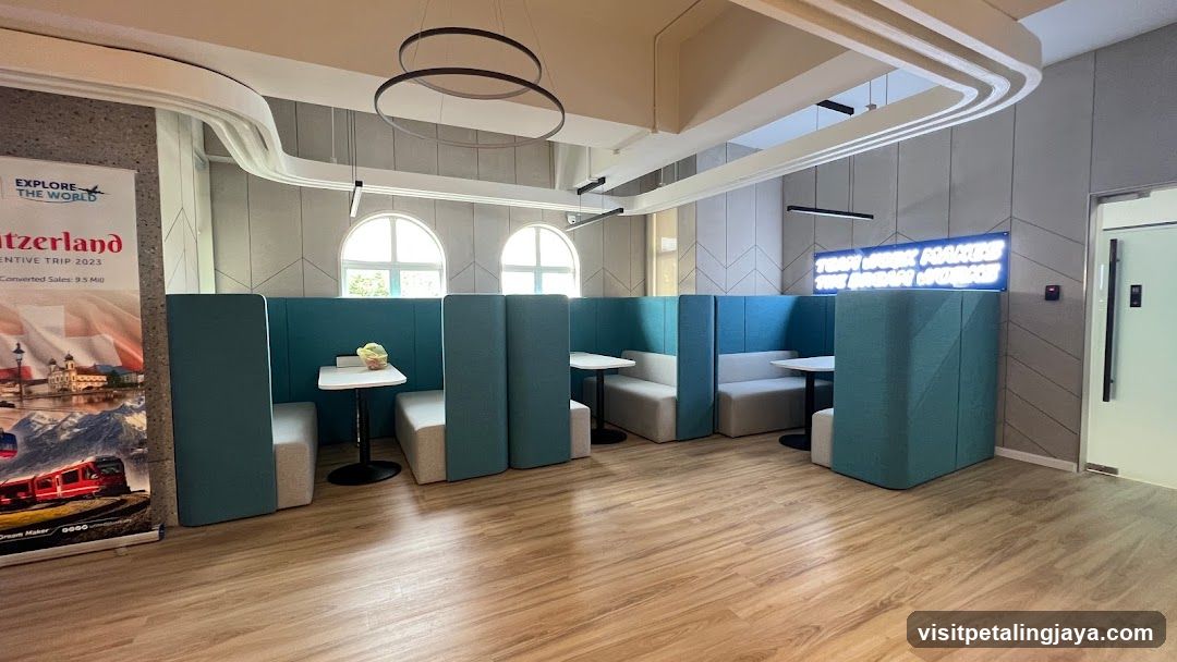 Modern Lounge Interior with Teal Booths and Travel Poster