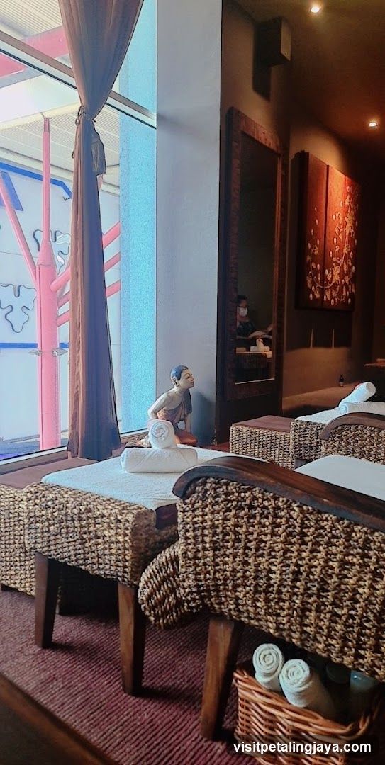 Spa Interior with Towel Rolls and Decorative Statue