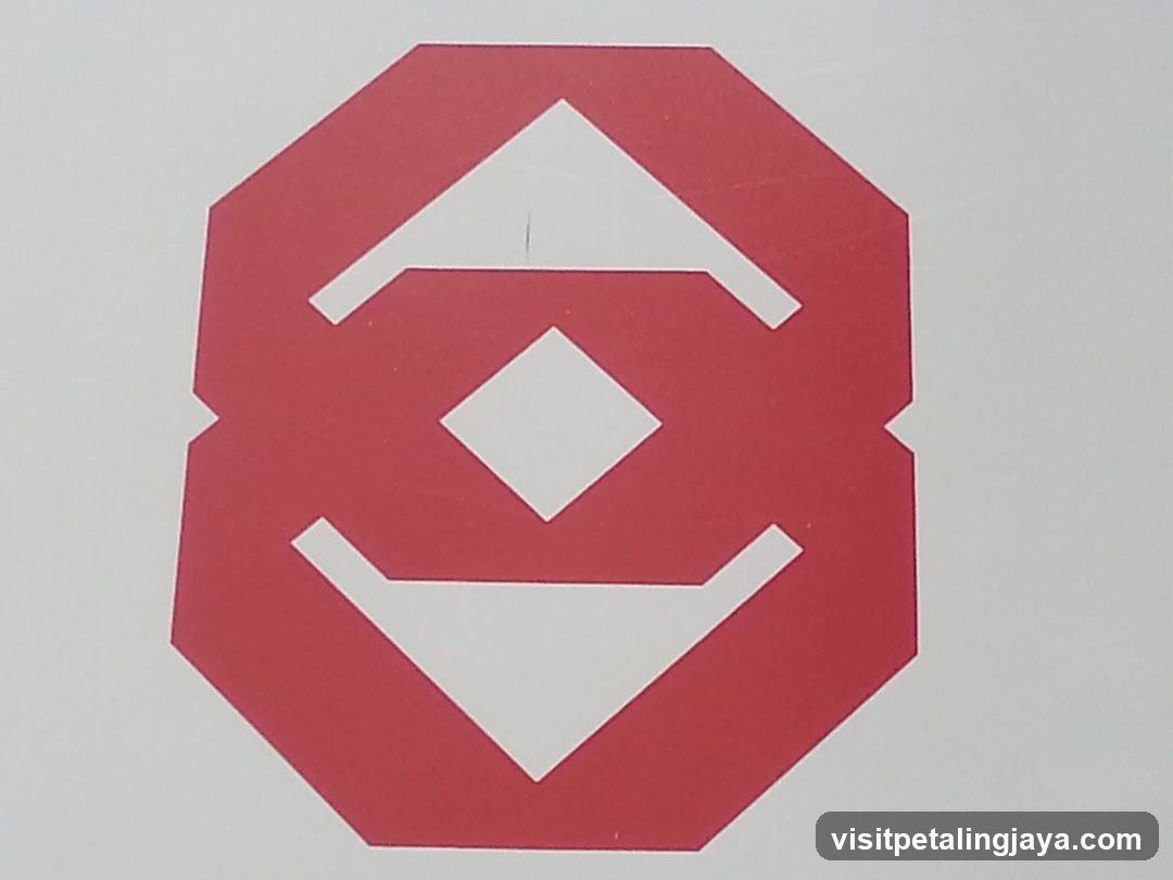 Red geometric logo on white background