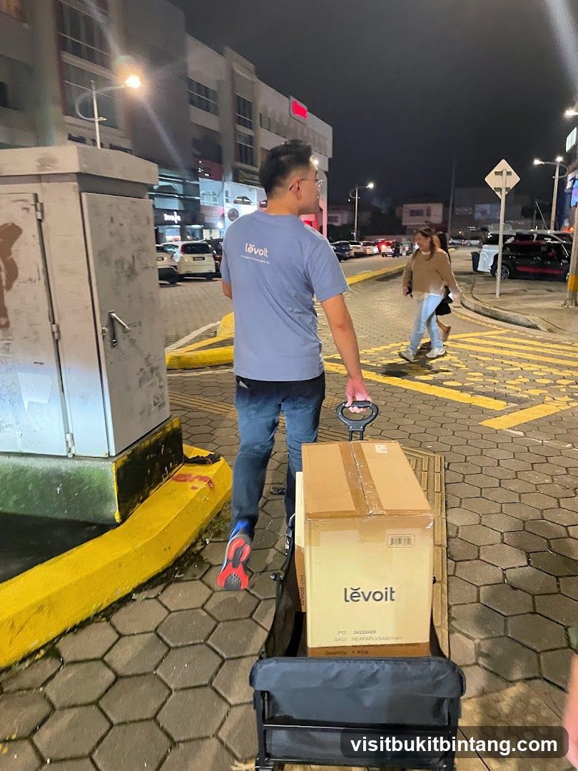 Man pulling a cart with boxes
