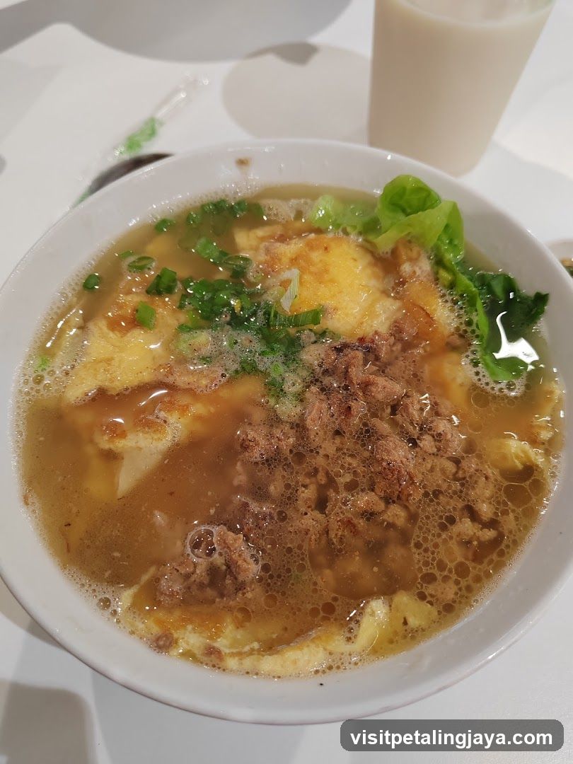 Bowl of Soup with Egg and Meat