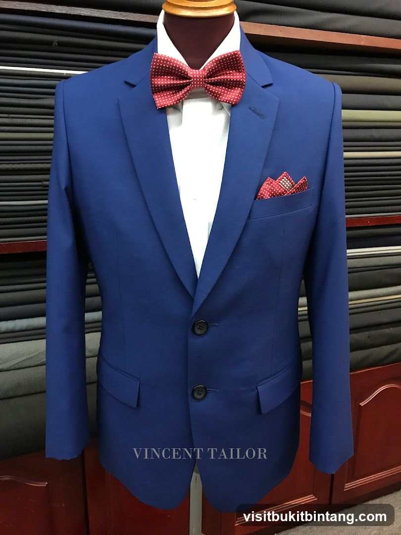 Blue Suit with Red Bowtie and Pocket Square