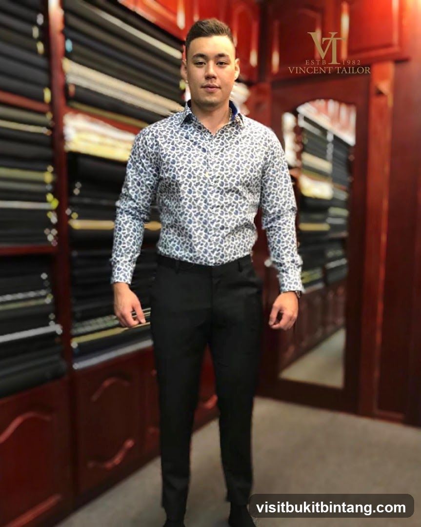 Man in a patterned shirt and black pants
