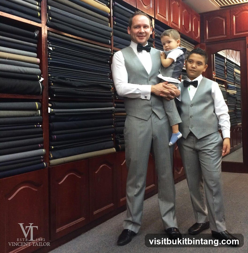 Three males in matching suits