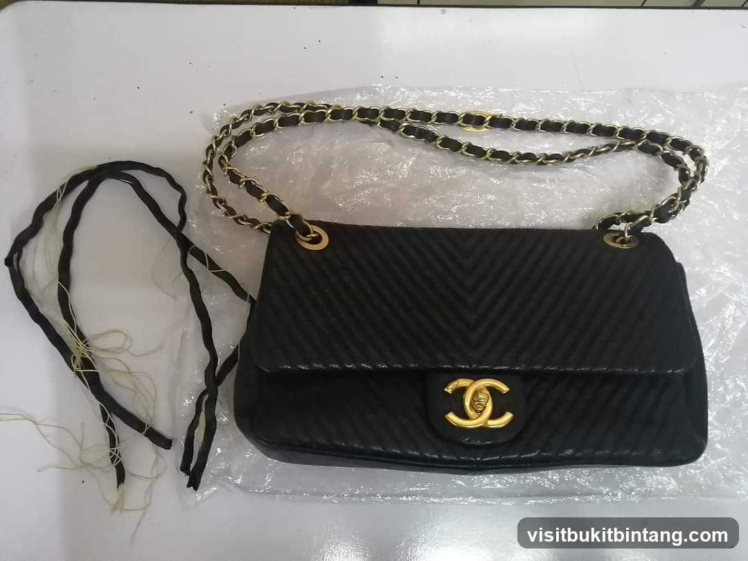 Black Quilted Handbag with Gold Chain Strap