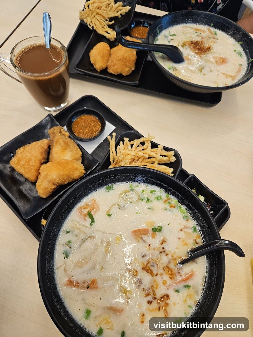 Two Bowls of Soup with Sides and a Drink