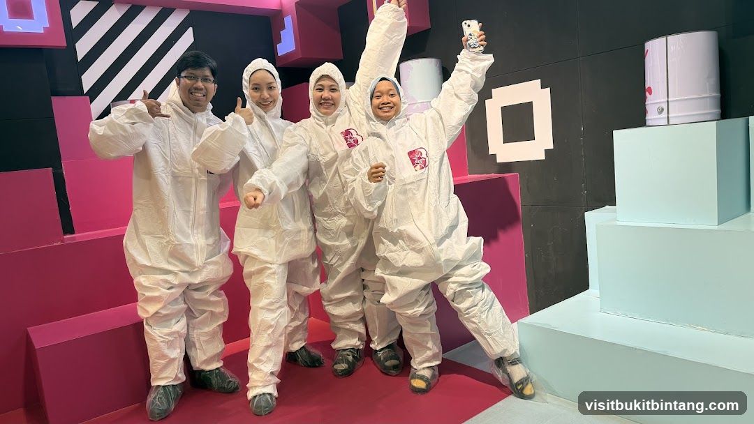 Group in protective suits posing for a photo