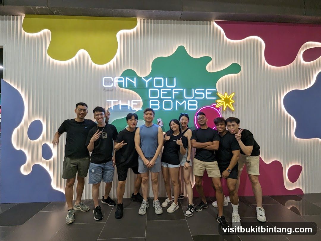 Group Posing in Front of Neon Sign