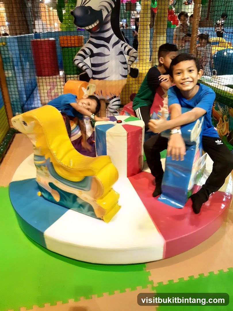 Children on a carousel in a play area