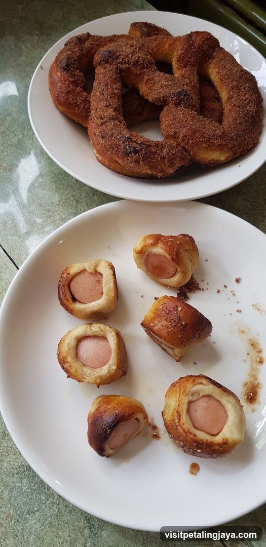 Food plates with pretzels and sausage rolls