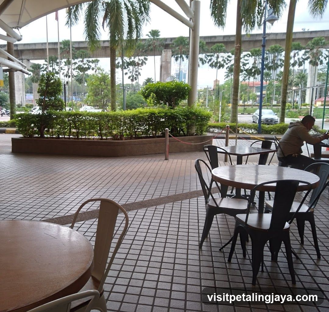 Outdoor Seating Area with Elevated Highway Background
